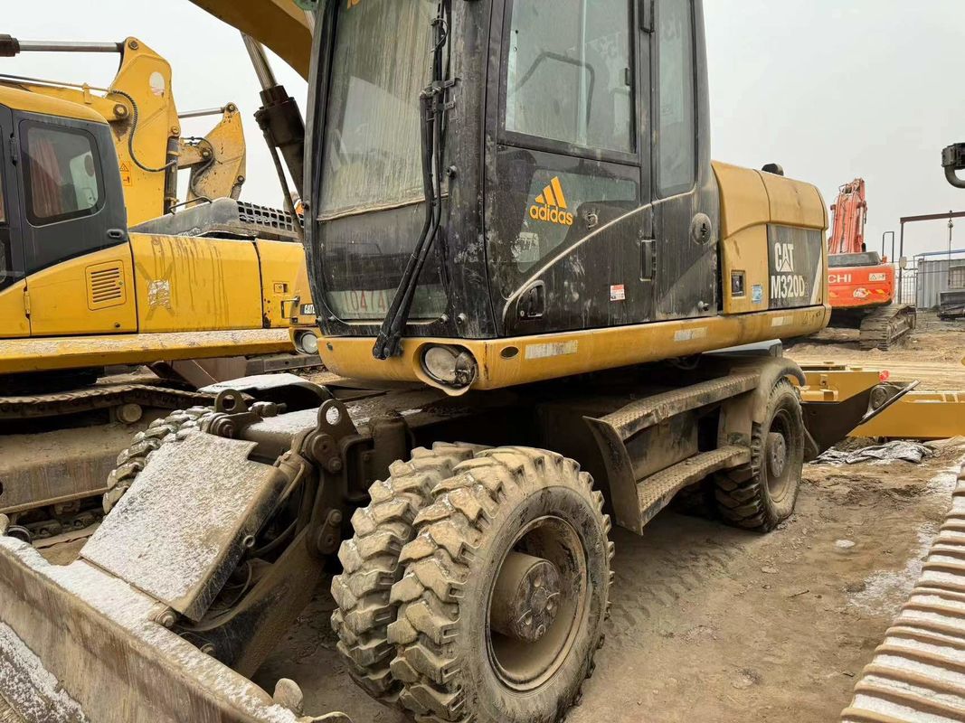 90% Caterpillar M317D2 Używany grabarz kołowy o wysokiej jakości i najlepszej wydajności na sprzedaż