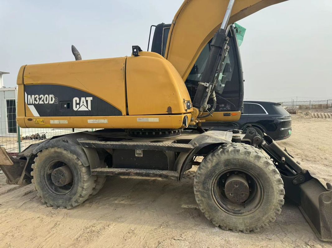 90% Caterpillar M317D2 Używany grabarz kołowy o wysokiej jakości i najlepszej wydajności na sprzedaż