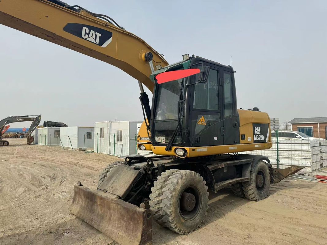 90% Caterpillar M317D2 Używany grabarz kołowy o wysokiej jakości i najlepszej wydajności na sprzedaż