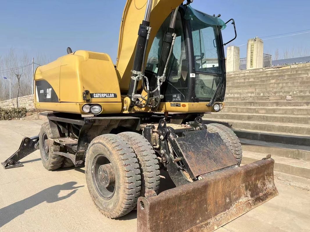 90% Caterpillar M317D2 Używany grabarz kołowy o wysokiej jakości i najlepszej wydajności na sprzedaż