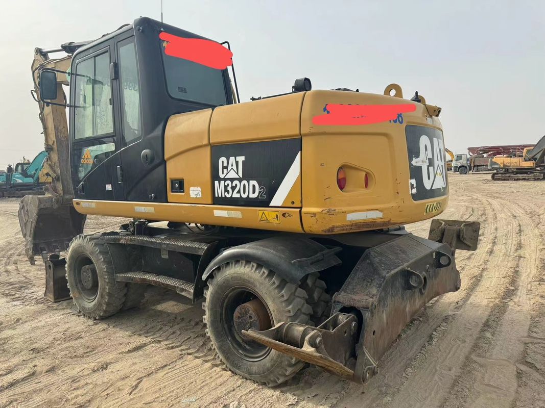 90% Caterpillar M317D2 Używany grabarz kołowy o wysokiej jakości i najlepszej wydajności na sprzedaż